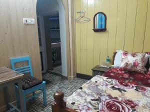 Postel nebo postele na pokoji v ubytování Smriya Homestay