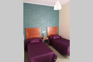 A bed or beds in a room at Alojamiento VuT Rupurupay B