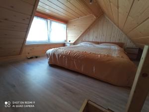 Postel nebo postele na pokoji v ubytování DOMEK WYPOCZYNKOWY DOMINIK