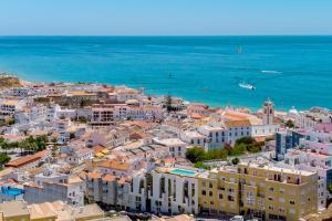 an aerial view of a city and the ocean at Colina do Mar in Albufeira