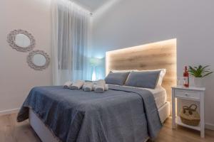 Postel nebo postele na pokoji v ubytování 1571_SUITES A1