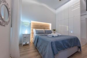 Postel nebo postele na pokoji v ubytování 1571_SUITES A1