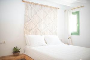 Voodi või voodid majutusasutuse Levantes Ios Boutique Hotel toas