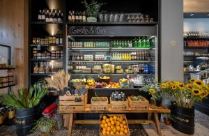 a store with a counter with fruits and vegetables at Hotel 75 by Prima Hotels in Tel Aviv