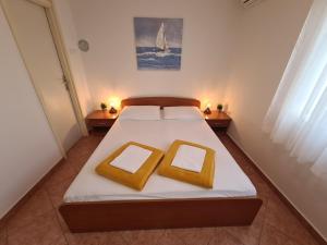 Posteľ alebo postele v izbe v ubytovaní Apartments and Rooms Mazuranic