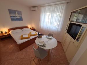Posteľ alebo postele v izbe v ubytovaní Apartments and Rooms Mazuranic