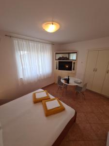 Posteľ alebo postele v izbe v ubytovaní Apartments and Rooms Mazuranic