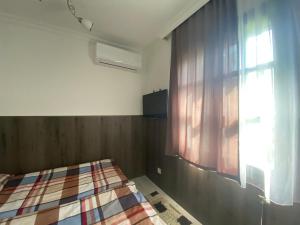 Postel nebo postele na pokoji v ubytování Holiday Apartmanház