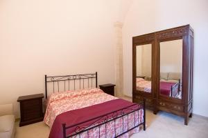 A bed or beds in a room at Appartamento Palazzo Ancona