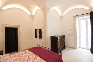 A bed or beds in a room at Appartamento Palazzo Ancona