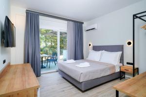 Postel nebo postele na pokoji v ubytování Solar Suites