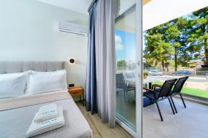 Postel nebo postele na pokoji v ubytování Solar Suites