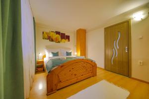 Ένα ή περισσότερα κρεβάτια σε δωμάτιο στο Mária Apartman