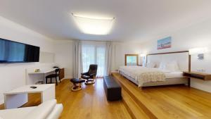 A bed or beds in a room at Hotel & Restaurant Dankl