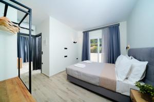 Postel nebo postele na pokoji v ubytování Solar Suites