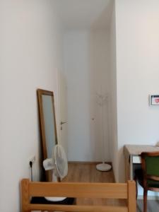 a bathroom with a toilet and a mirror in a room at San Eleuterio Guesthouse in Poreč