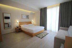 Postel nebo postele na pokoji v ubytování Hotel Ari 2