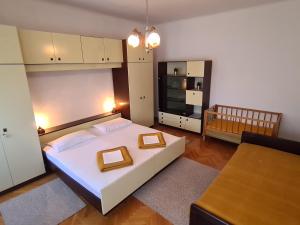 Posteľ alebo postele v izbe v ubytovaní Apartments and Rooms Mazuranic