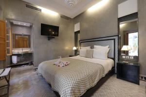 Voodi või voodid majutusasutuse Riad L'Etoile D'Orient toas