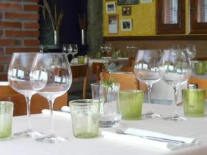 a group of wine glasses sitting on a table at Hostal l´Ou de Reig in Montseny