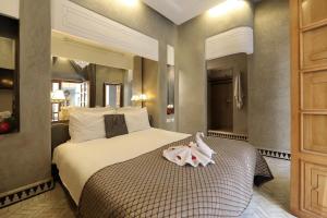 Voodi või voodid majutusasutuse Riad L'Etoile D'Orient toas