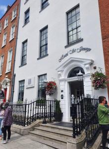 a building with a white door and a black and white door at Hotel St George by Nina in Dublin