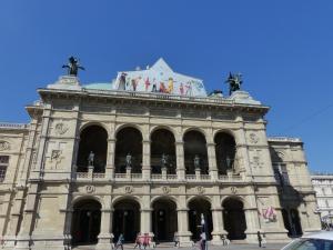 a large building with statues on the top of it at Apartment Naschmarkt in Vienna