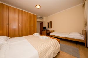 Postel nebo postele na pokoji v ubytování Villa Anggela