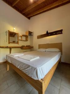 Postel nebo postele na pokoji v ubytování Pension Oasis