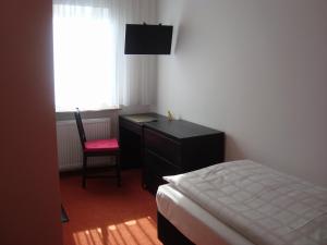 Postel nebo postele na pokoji v ubytování Hotel Gartenhof