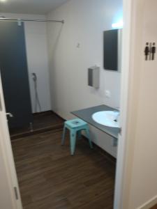 A television and/or entertainment centre at Agora Hostel
