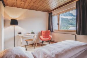 Postel nebo postele na pokoji v ubytování BOUTIQUEHOTEL das edelweiss