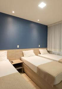Cama ou camas em um quarto em Hotel Vila Leste