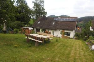a house with a picnic table in front of it at Bergblick in Medebach