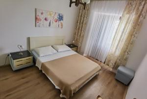 Postel nebo postele na pokoji v ubytování Apartman Kampor