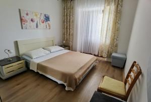 Postel nebo postele na pokoji v ubytování Apartman Kampor