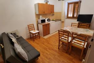 Kuchyň nebo kuchyňský kout v ubytování Apartman Kampor