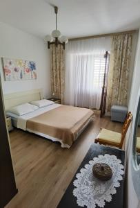Postel nebo postele na pokoji v ubytování Apartman Kampor