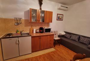 Kuchyň nebo kuchyňský kout v ubytování Apartman Kampor