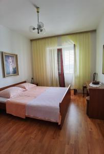 Postel nebo postele na pokoji v ubytování Apartman Kampor