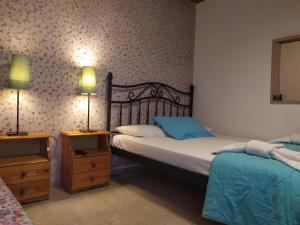 Postel nebo postele na pokoji v ubytování Aiolis Rooms