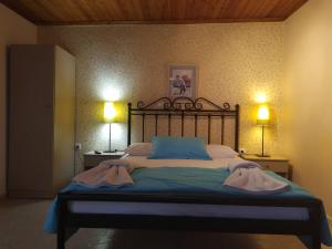 Postel nebo postele na pokoji v ubytování Aiolis Rooms
