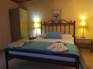 Postel nebo postele na pokoji v ubytování Aiolis Rooms