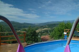 a swimming pool with a view of the mountains at Casa Elisa in Bibbiena