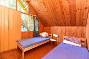 Postel nebo postele na pokoji v ubytování Camping Vaivari Jūrmala