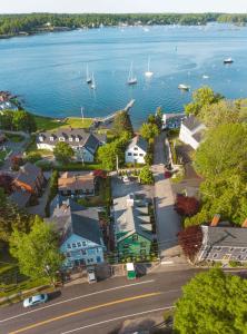 an aerial view of a small town next to the water at GREAT ISLAND INN - A Modern Boutique Hotel in New Castle