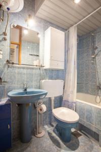 a bathroom with a sink and a toilet and a tub at Villa Ban in Podgora +50 photos