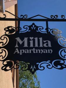 a sign for a munaarmaarma restaurant on a building at Milla Apartman in Szentendre