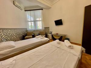 Voodi või voodid majutusasutuse Olive hotel toas