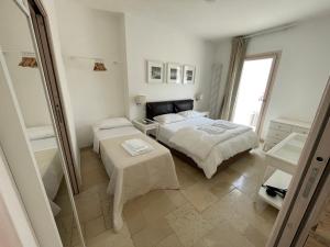 Postel nebo postele na pokoji v ubytování Barbacana46 Guest House